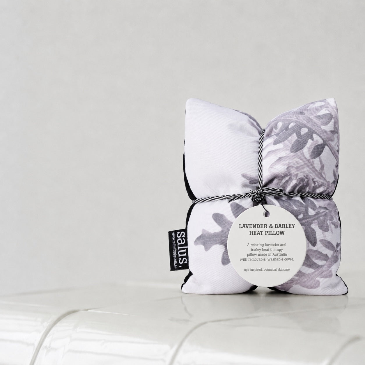 Salus Lavender & Barley Heat Pillow in grey with botanical design, soft fabric and rectangular shape for soothing warmth and relaxation.