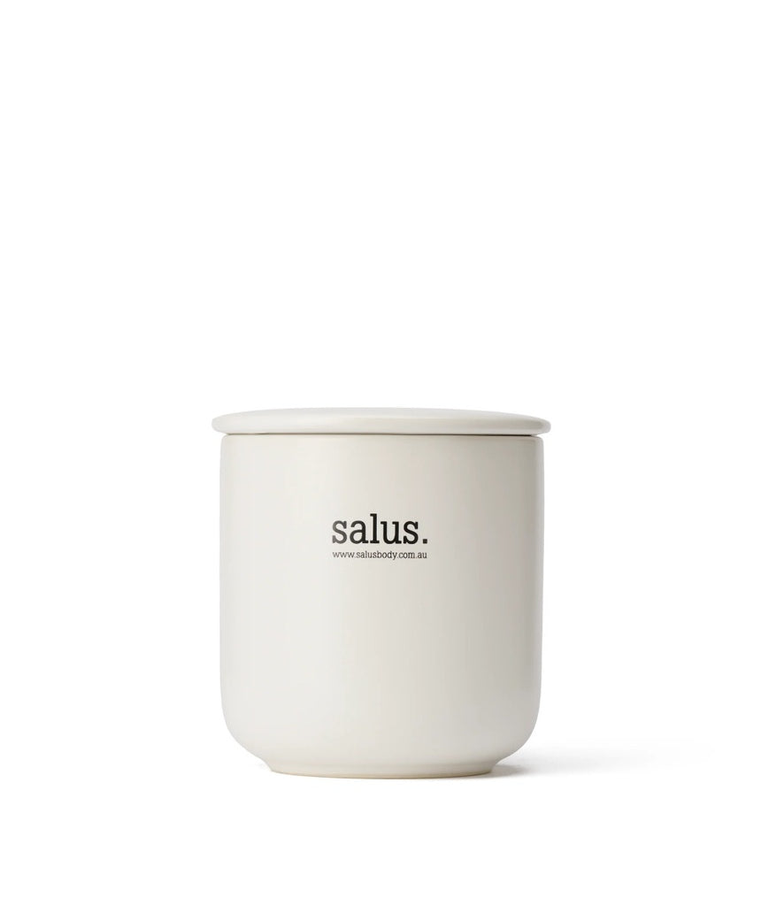 Salus Lemongrass Soy Candle with a glass jar, natural wick, and fresh lemongrass scent, burns for 55-65 hours.