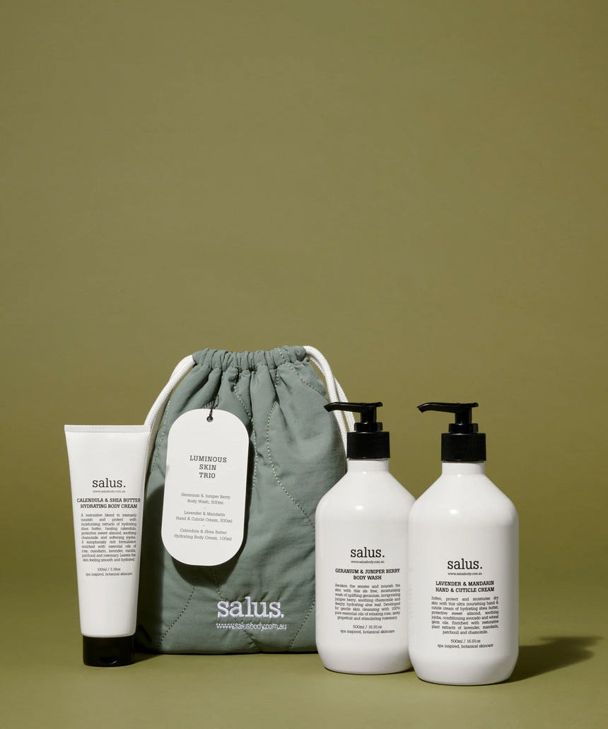 Salus Luminous Skin Trio gift set with skincare products displayed in a lifestyle setting, highlighting luminous, radiant skin.