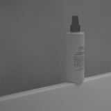 Salus Patchouli & Rose Ultra Moisture Body Oil bottle, 200ml, featuring a sleek design and transparent packaging with a floral label.