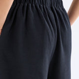 Elk Sanna Pant in black, stylish and comfortable pants with a relaxed fit, made from soft fabric, displayed on a model.