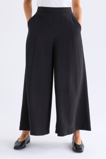 Black Elk Rema Pant displayed on a model, showcasing slim fit style and sleek design for versatile casual or semi-formal wear.