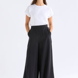 Black Elk Rema Pant showing slim-fit design and tapered leg, made from comfortable fabric for casual or stylish wear.