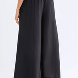 Black Elk Rema Pant displayed on a model, featuring a slim fit and stylish design perfect for casual or everyday wear.