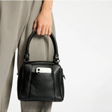 Black Status Anxiety Mini Mountains Bag featuring a compact design with leather accents, perfect for casual and everyday use.