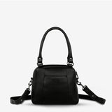 Black Status Anxiety Mini Mountains Bag with adjustable strap and minimalist mountain design on front view.