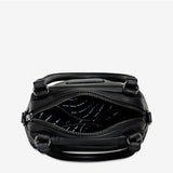 Black Status Anxiety Mini Mountains Bag open with zipper, stylish small bag for essentials with mountain-inspired design.