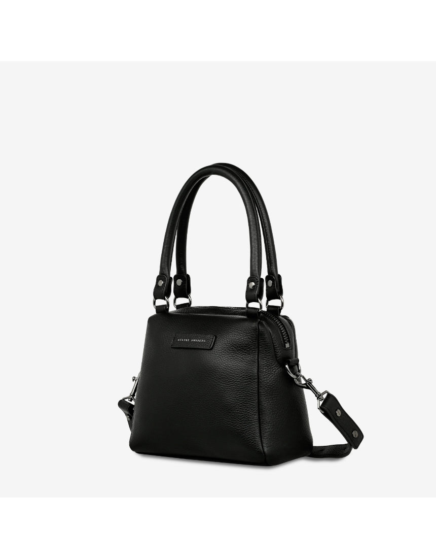 Status Anxiety Mini Mountains bag in black, showing side and front view of this stylish, compact bag with mountain-themed design.