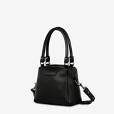 Status Anxiety Mini Mountains bag in black, showing side and front view of this stylish, compact bag with mountain-themed design.