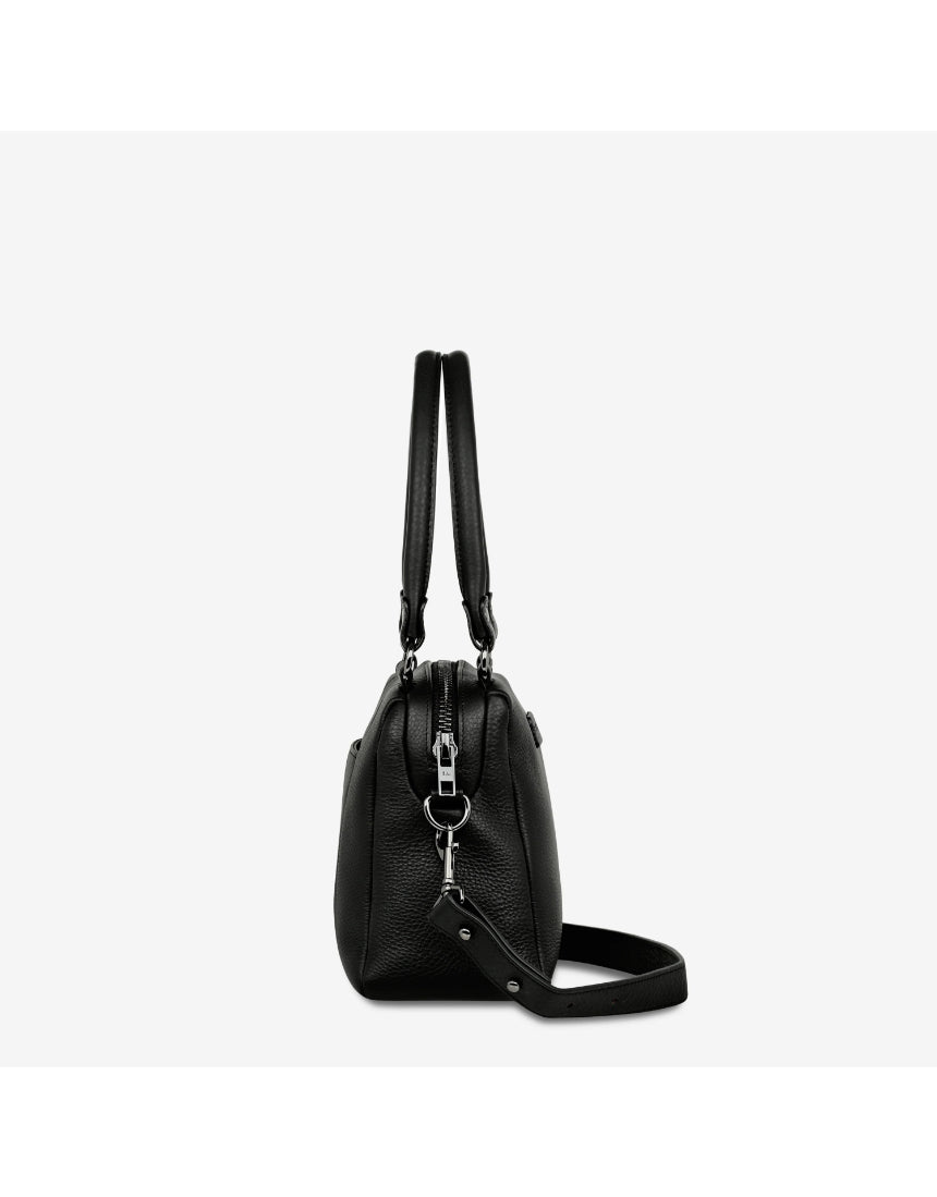 Black Status Anxiety Mini Mountains Bag with front zipper pocket and adjustable strap, stylish and compact for everyday use.