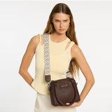 Status Anxiety Mini Mountains Bag in cocoa color, stylish leather bag with compact design and adjustable strap.