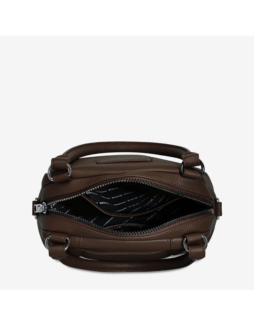 Open Status Anxiety Mini Mountains Bag in cocoa color showing its compact design and zipper closure.