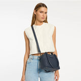 Mini Mountains bag by Status Anxiety in midnight blue, featuring a compact design and stylish zipper closure.