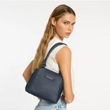 Status Anxiety Mini Mountains Bag in midnight blue, stylish compact bag with adjustable strap and mountain-inspired design.