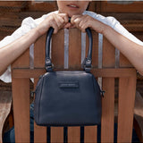 Status Anxiety Mini Mountains bag in midnight blue, stylish and compact bags with mountain-inspired design and adjustable strap.