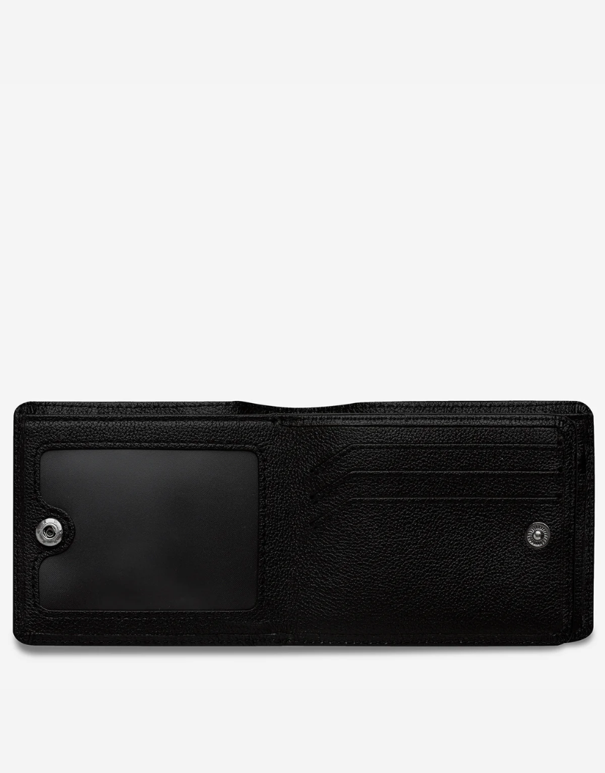 Black Leonard Wallet by Status Anxiety, a stylish leather wallet with multiple card slots and a sleek design.