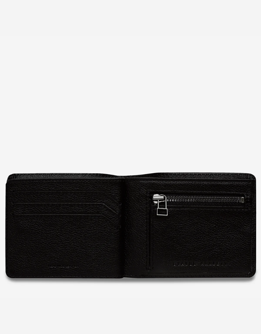 Black Status Anxiety Leonard Wallet showing multiple card slots and a sleek design, made from durable leather.
