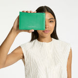 Status Anxiety Gone Again Wallet in Emerald Nappa - lifestyle view