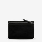 Black Status Anxiety Is Now Better Wallet with smooth leather finish, featuring multiple card slots and a sleek, modern design.