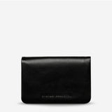Black Status Anxiety Is Now Better Wallet with smooth leather front, compact design, and multiple card slots.