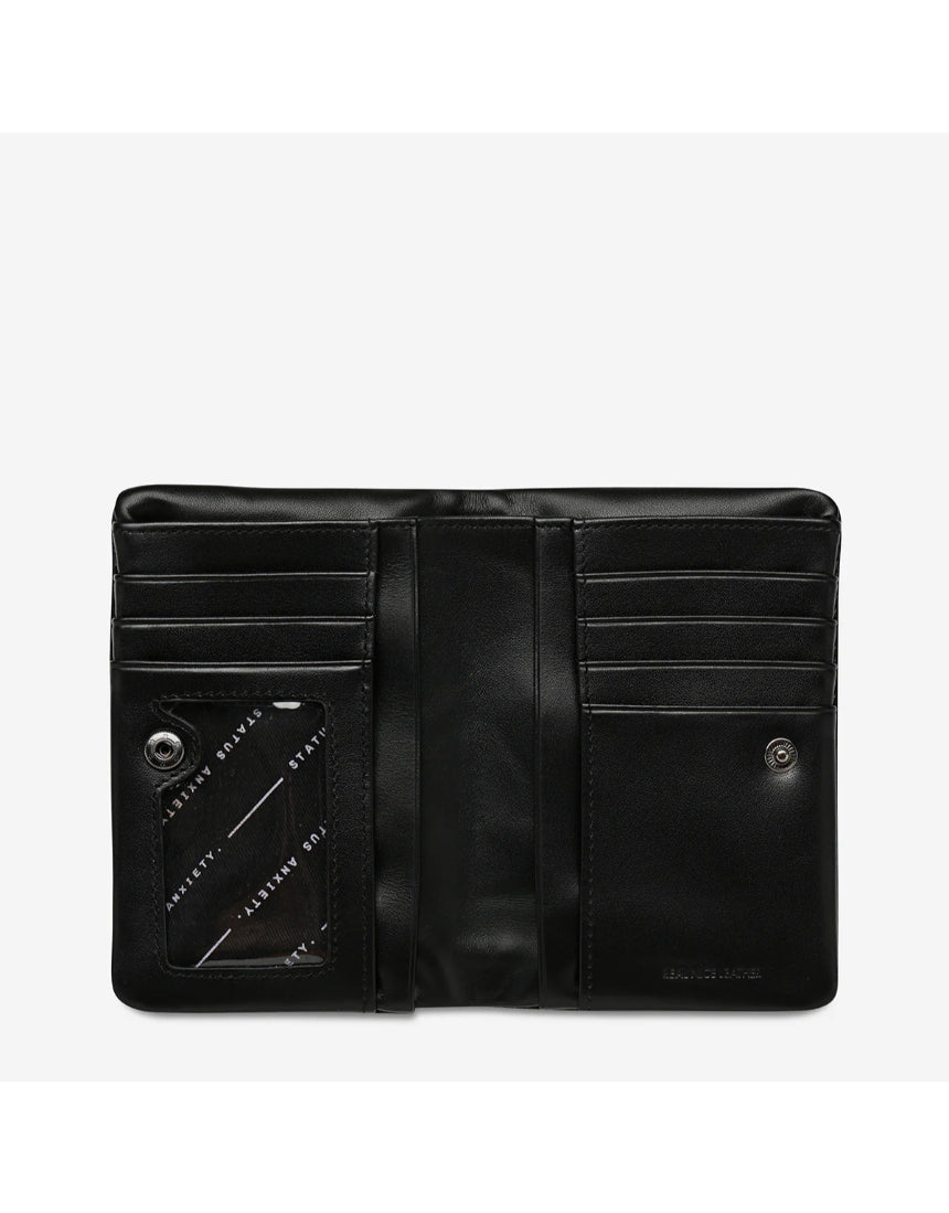 Black Status Anxiety Is Now Better Wallet open to show smooth leather interior and multiple card slots.