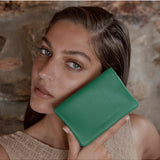 Emerald Status Anxiety Is Now Better Wallet showing multiple card slots and sleek design for everyday use