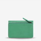 Status Anxiety Is Now Better Wallet with smooth emerald green leather and sleek design, perfect for organizing cards and cash.