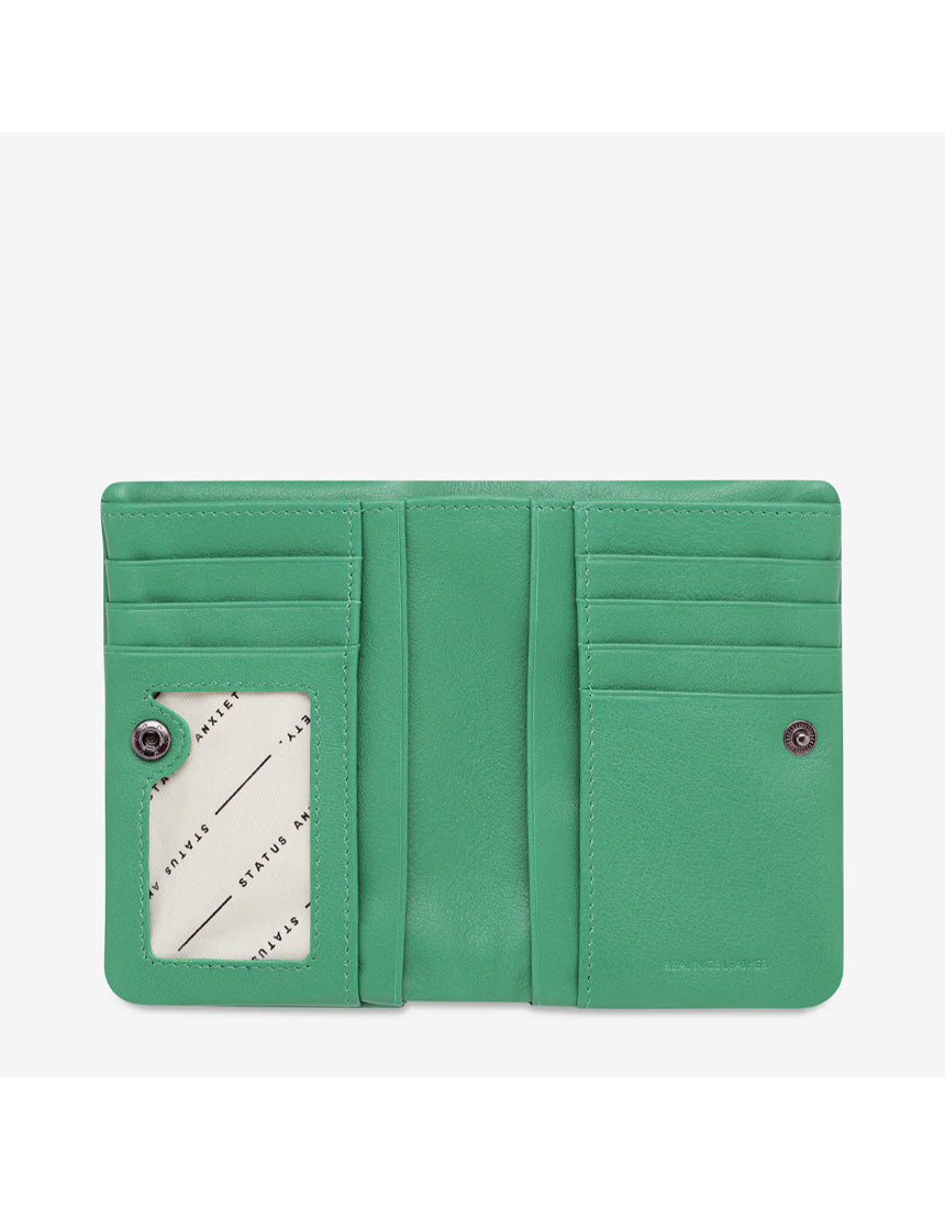 Open Status Anxiety Is Now Better Wallet in emerald with smooth leather finish, showing multiple card slots and organization features.