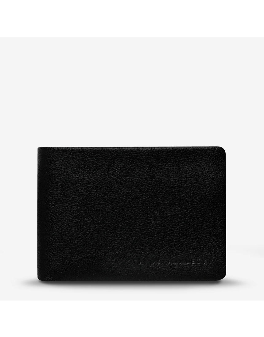 Black Status Anxiety Jonah Wallet with front view, showcasing its sleek design and compact wallet features.