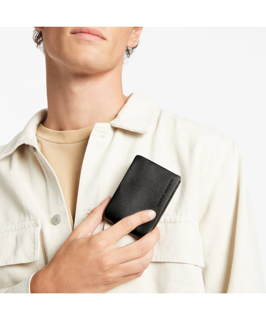 Black Status Anxiety Jonah Wallet with multiple card slots and wallet compartments, made from genuine leather.
