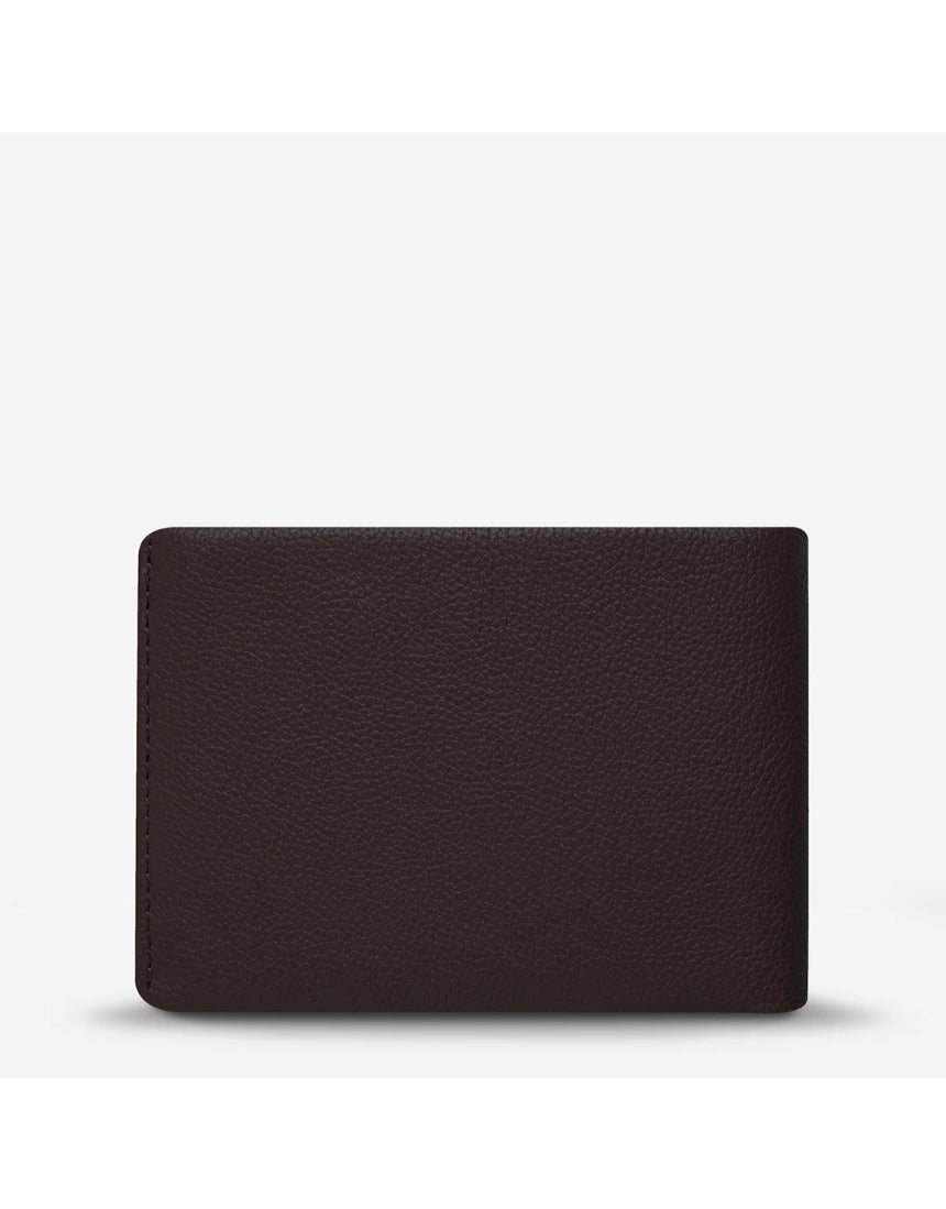 Status Anxiety Jonah Wallet in chocolate brown, featuring multiple card slots and a sleek leather design.