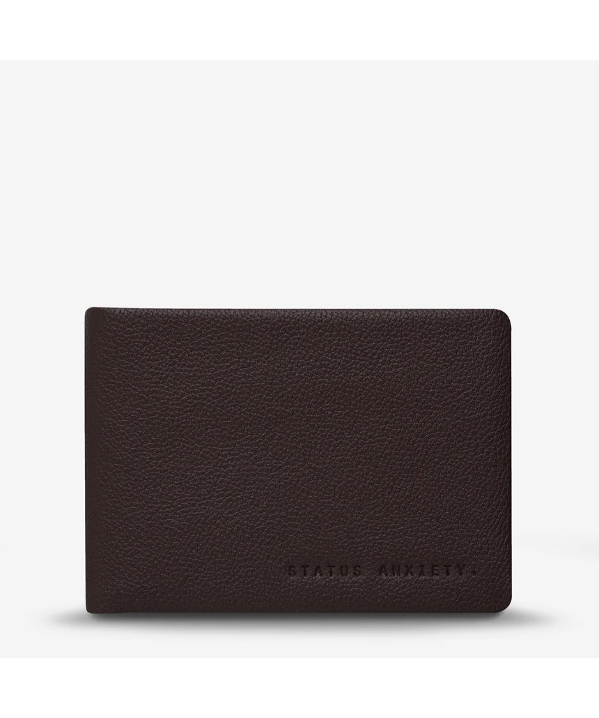 Status Anxiety Jonah Wallet in chocolate color, front view showing sleek leather design and compact wallet features.