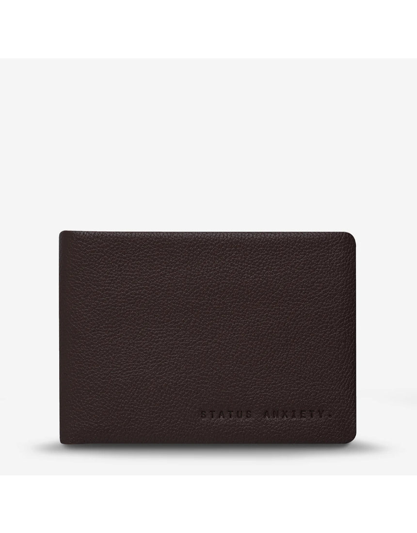 Status Anxiety Jonah Wallet in chocolate color, front view showing sleek leather design and compact wallet features.