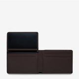 Open Status Anxiety Jonah Wallet in chocolate brown showing card slots and interior details. Stylish men's wallet with multiple compartments.