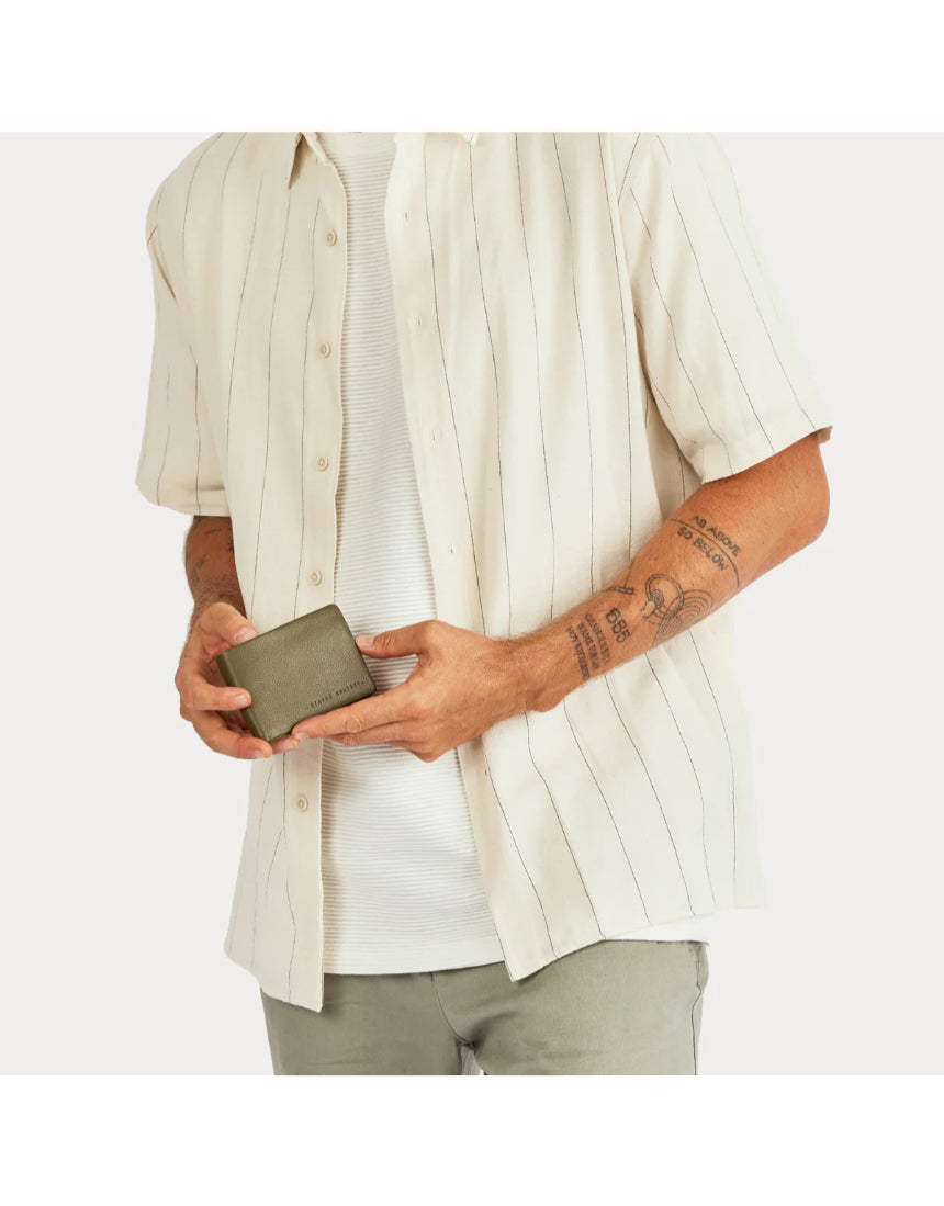 Status Anxiety Jonah Wallet in khaki, a compact leather wallet with multiple card slots and a sleek design.