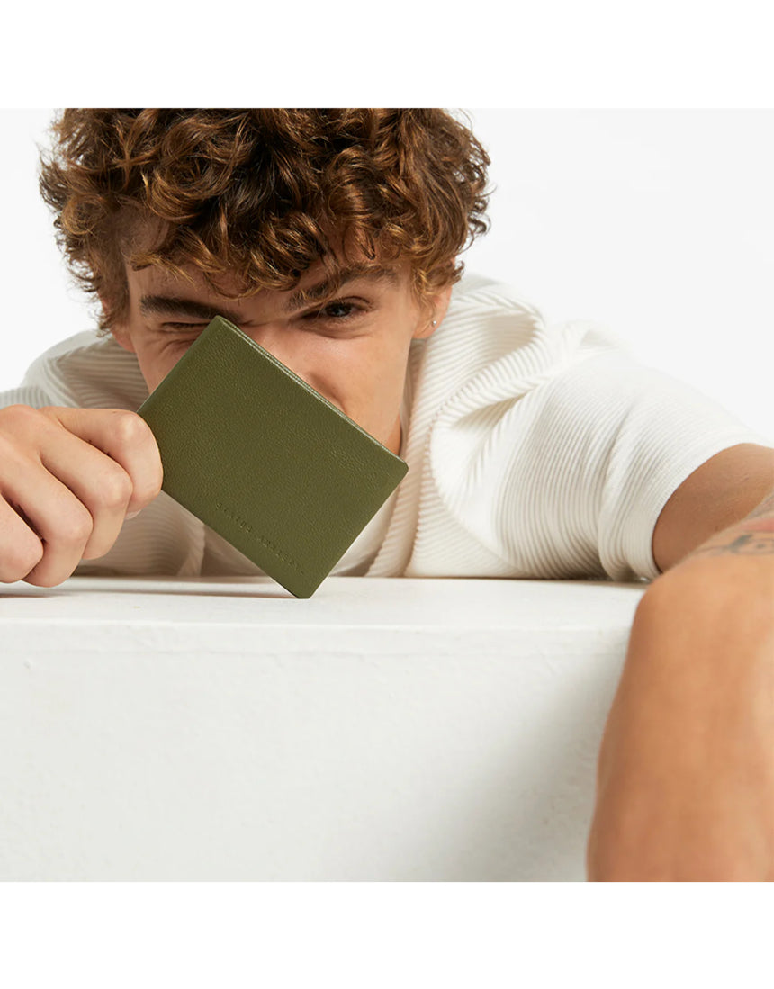 Khaki Status Anxiety Jonah Wallet with multiple card slots and sleek design, made from durable leather.