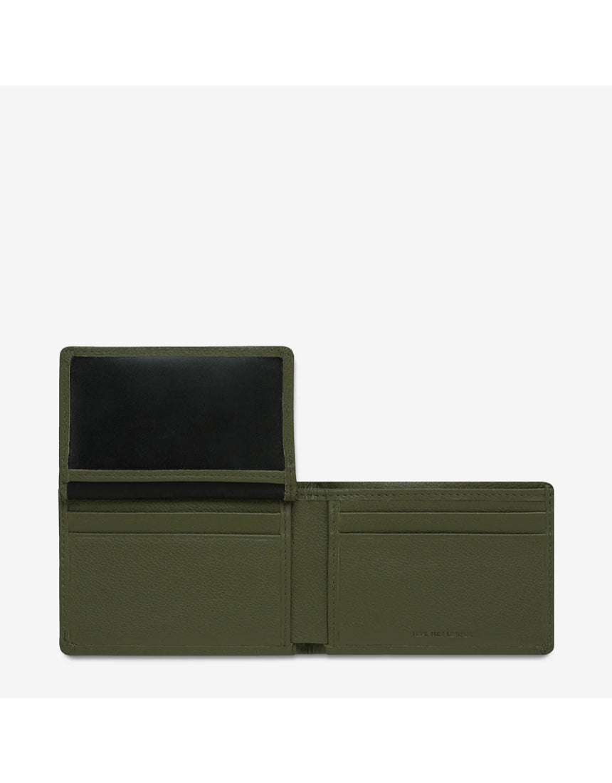 Open Status Anxiety Jonah Wallet in khaki showing card slots and compartments, made of durable leather.
