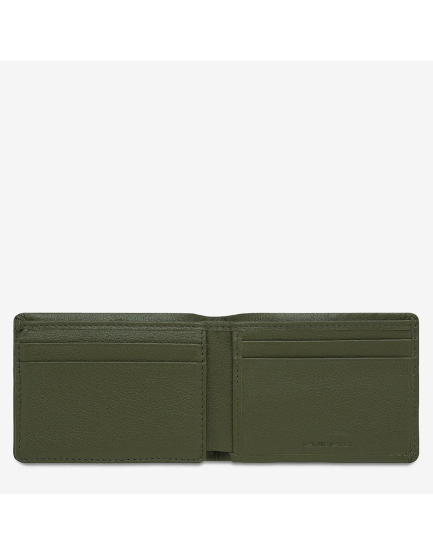 Open Status Anxiety Jonah Wallet in khaki showing multiple card slots and cash compartment, made of durable leather.
