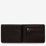 Status Anxiety Leonard Wallet in chocolate brown with multiple card slots and a sleek design, shown open to reveal interior compartments.