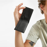 Black Status Anxiety Otis Wallet with multiple card slots and compact design, shown with lifestyle background.