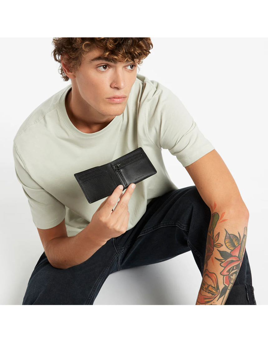 Black Status Anxiety Otis Wallet with multiple card slots and sleek leather design for everyday use.