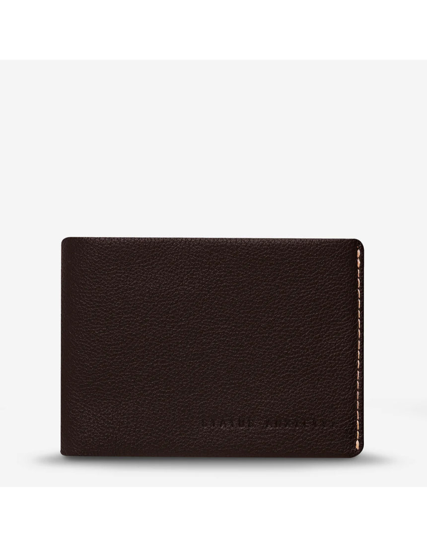 Status Anxiety Otis Wallet in chocolate brown, compact leather wallet with multiple card slots and a minimalist design.