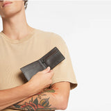 Chocolate Status Anxiety Otis Wallet with multiple card slots and a sleek, compact design for everyday use.