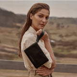 Black Status Anxiety Take Your Chances wallet with multiple card slots and a sleek, minimalist design.