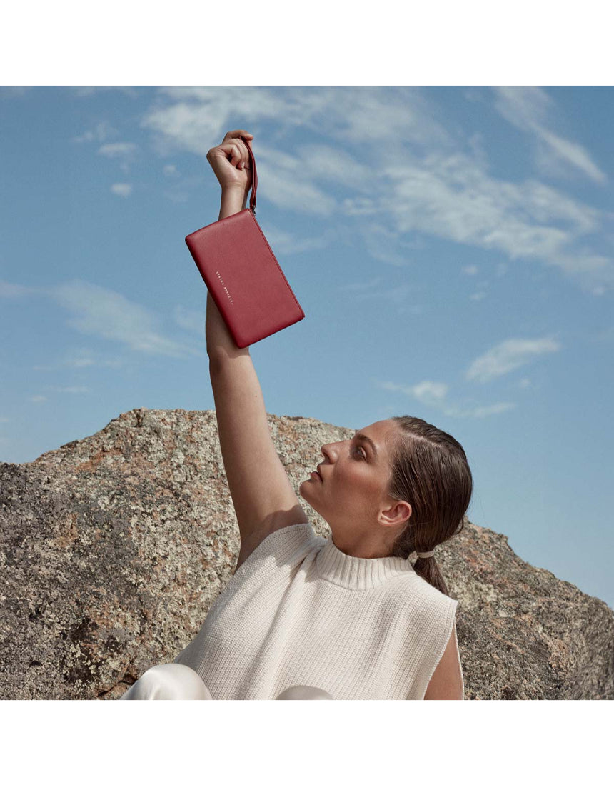 Status Anxiety Take Your Chances Wallet in rouge, featuring multiple card slots and a sleek design for everyday use.