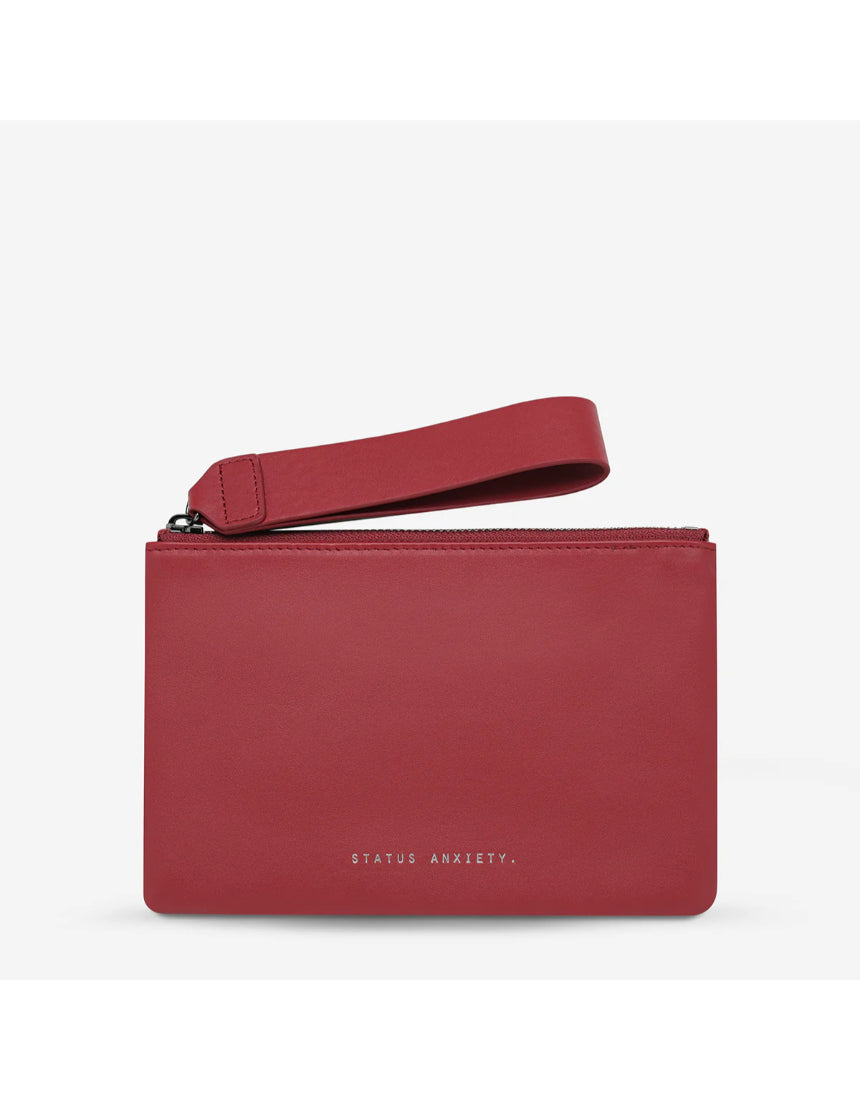 Status Anxiety Take Your Chances Wallet in rouge with smooth front leather, featuring compact design and card slots.