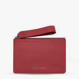 Status Anxiety Take Your Chances Wallet in rouge with smooth front leather, featuring compact design and card slots.