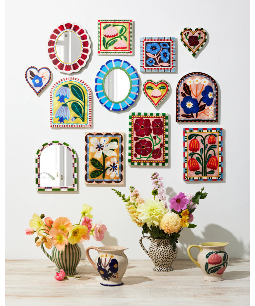 Jones & Co Bloom Nouveau Wine Heart wall decor with floral design, featuring vibrant colors and decorative elements on a wall.