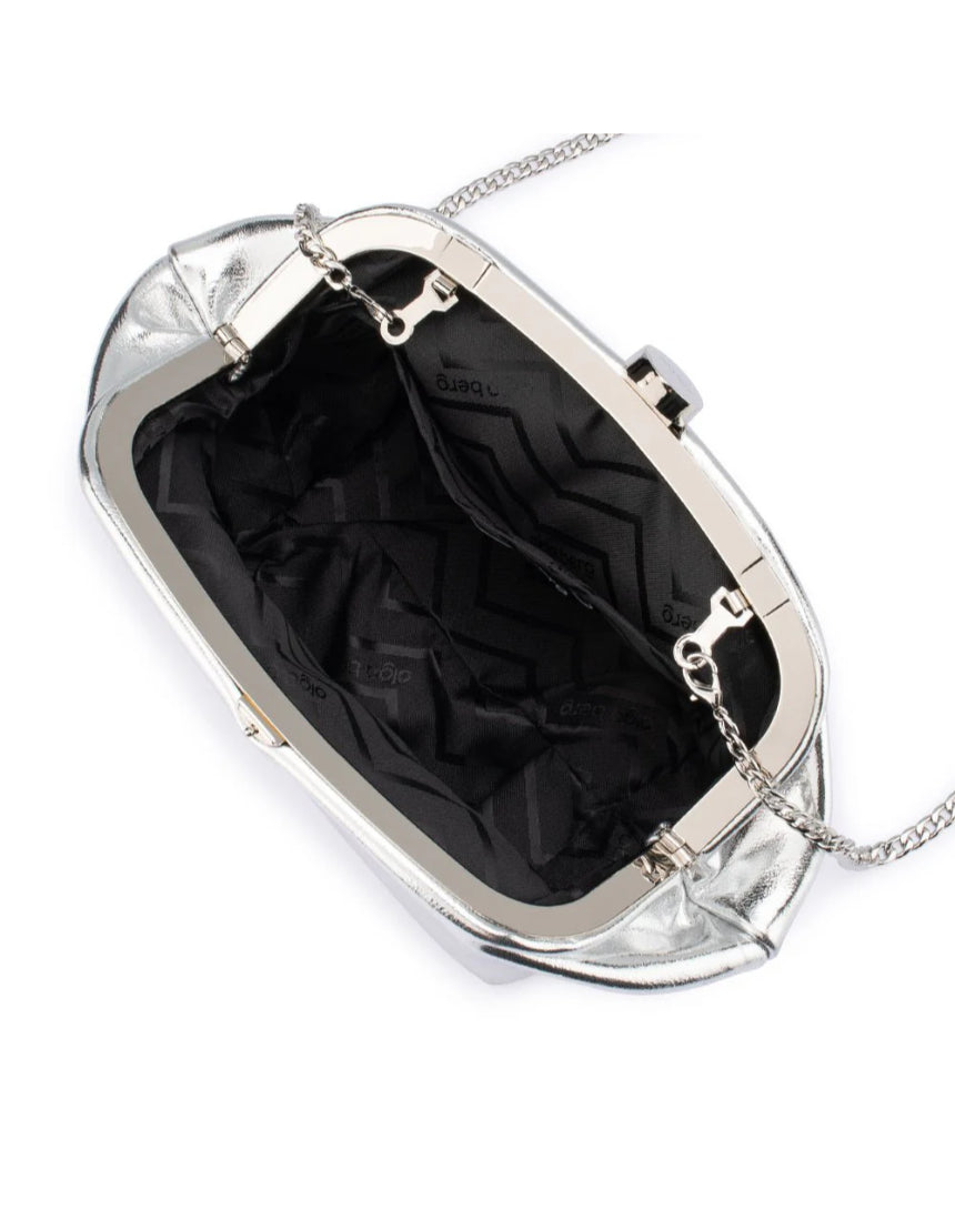 Olga Berg Tally metallic silver clutch bag with sleek design and shiny finish, perfect for evening events and formal occasions.