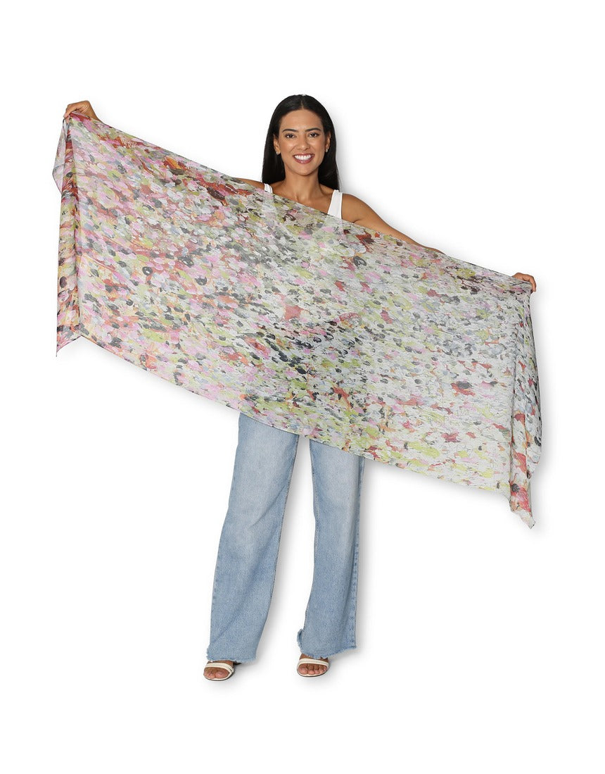 The Artists Label Julie’s Garden scarf featuring a vibrant floral pattern on soft fabric, displayed flat in natural light.